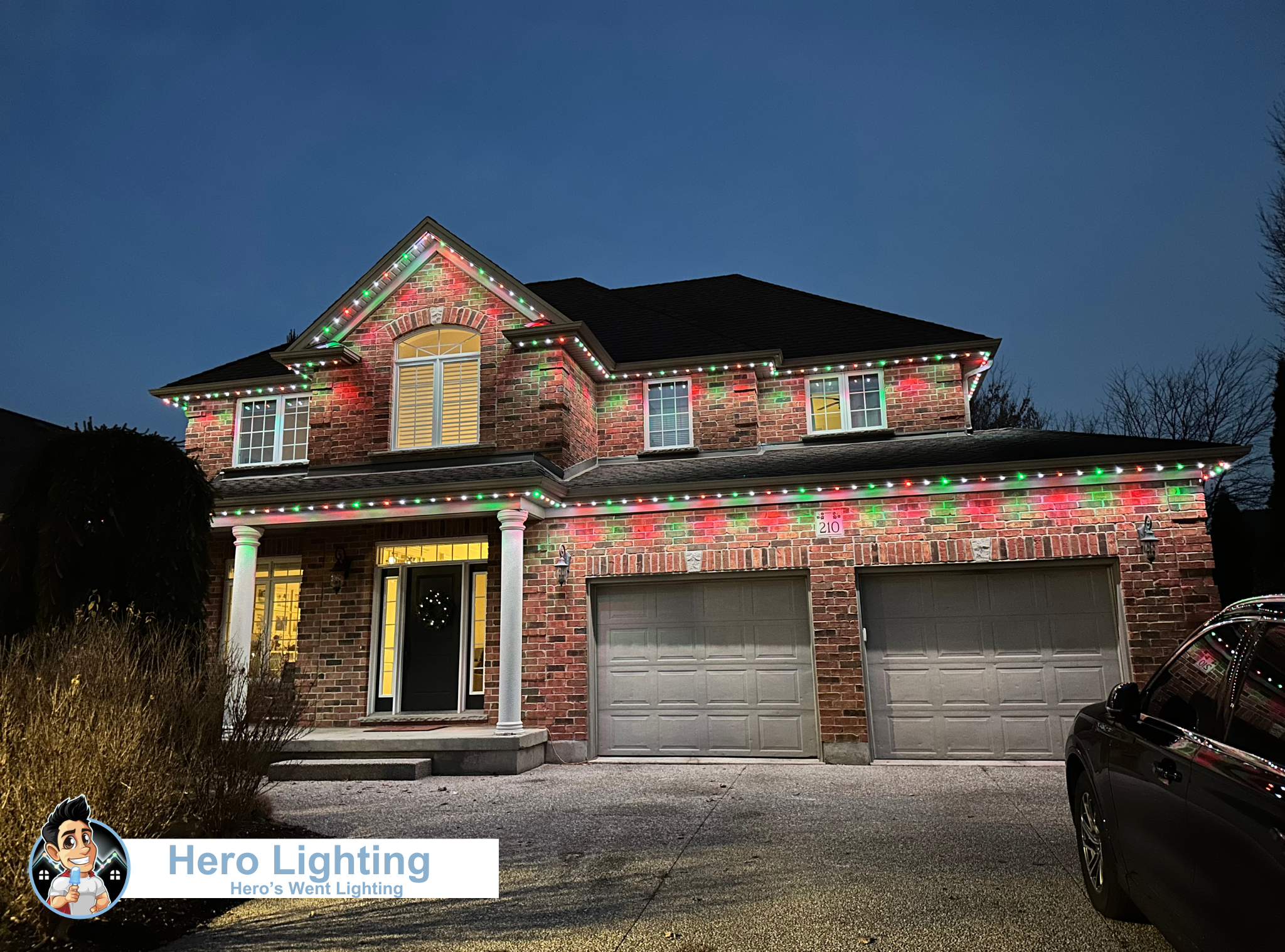 Red and green Christmas LED lights on brick home