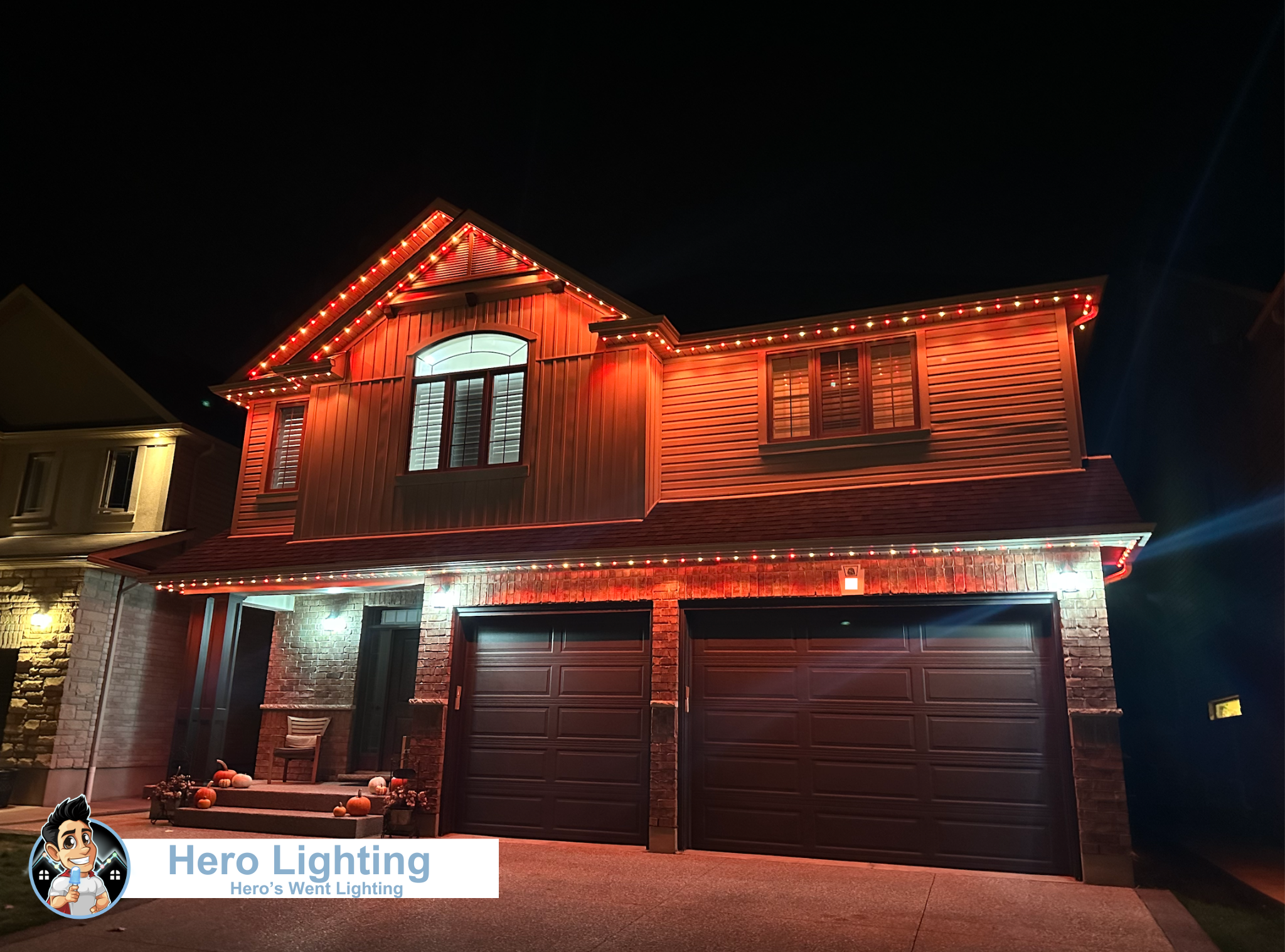Orange LED lights on home with three-car garage